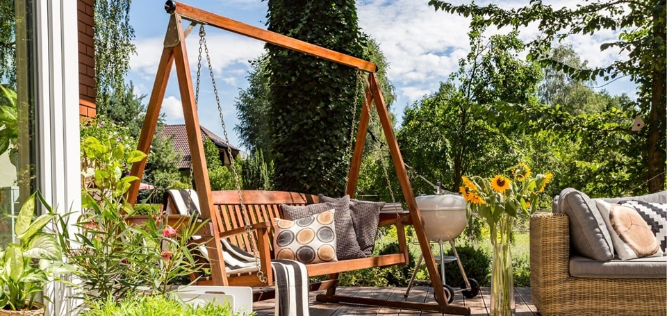 image of a swing with cushion at a patio