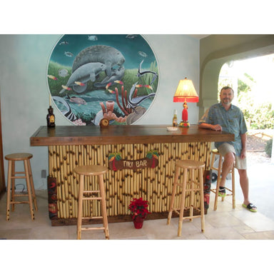 White_Sands_Islander_no_roof_outdoor_tiki_bar_inside_with_guy_sitting